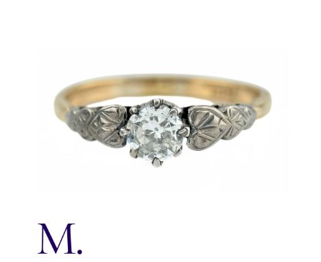 A Diamond Solitaire Ring in 18k gold, set with a round cut diamond of approximately 0.50cts with engraved, graduated heart sh