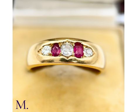 A Ruby and Diamond Gypsy Ring The 18ct yellow gold band is set with two bright rubies and three old cut diamonds weighing app