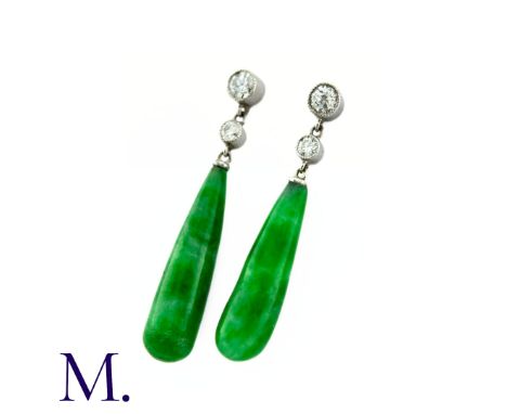 A Pair of Jade Drop Earrings in platinum, two round brilliant cut diamonds suspending the polished jade drops. Size: 3.2cm We