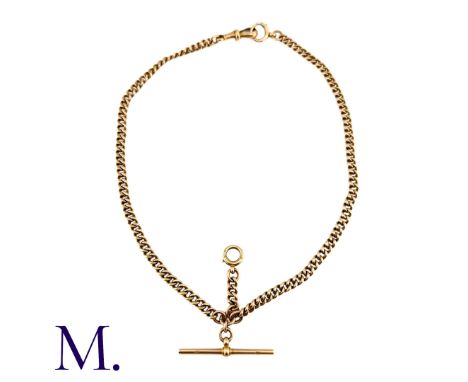 An Antique Albert Chain in 9k yellow gold comprising a series of interlocking curb links and comes together at a T-Bar pendan