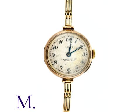 ROLEX, An Antique Ladies Wristwatch in 9k yellow gold, the silvered dial with Arabic numerals within a ring of minute-markers