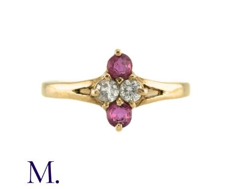 A Ruby And Diamond Ring in 9k yellow gold, the central kite-shaped motif formed of two round cut diamonds and two round cut r