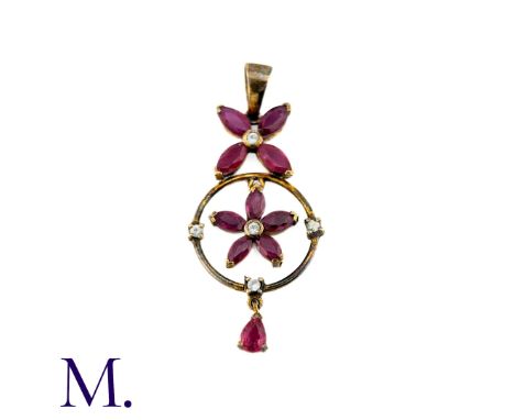 An Antique Ruby And Diamond Pendant in yellow gold, set with marquise rubies and round cut diamonds. (unmarked but tests indi