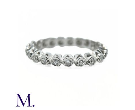 A Diamond Eternity Ring set with 21 round cut diamonds weighing approximately 0.42ct in total.Weight: 2.8gSize: L1/2