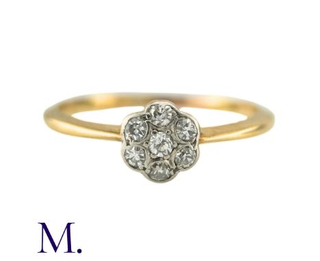 A Diamond Cluster Ring in yellow gold, the central cluster set with round cut diamonds totalling approximately 0.25cts. (Unma