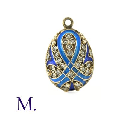 An Enamelled Egg Pendant with light and dark blue enamel, set with white paste stones. No markings visible. Size: 2.6cm Weigh