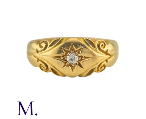 An Antique Diamond Ring in 18k yellow gold, set to the centre with a round cut diamond within an engraved star motif, with fu