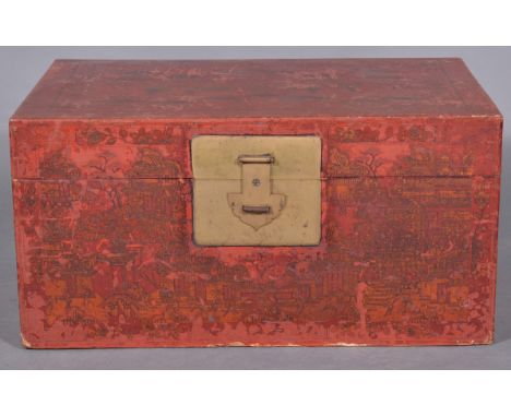 A Chinese red lacquer and chinoiserie trunk, painted with figurative scenes, large brass hasp plate, width 89cms, height 40cm