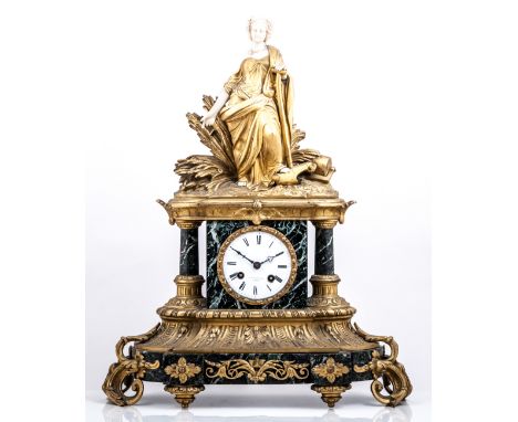 A Louis Philippe ormolu marble and ivory mantel clock, the case surmounted by a standing figure emblematic of labour, (ivory 