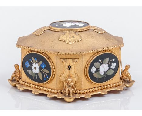 A gilt metal and pietra dura lozenge shape casket, probably French mid 19th Century, domed lid, with a cruciform surround to 