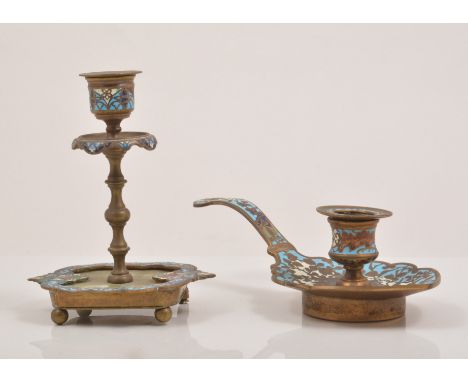 A champleve enamel brass and alabaster faced candlestick, slender ringed column , shaped platform, lacking foot and a Europea