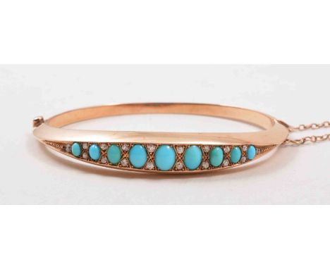 A Victorian rose metal half hinged bangle, set with nine graduating oval cabochon turquoise, spaced by pairs of old cut diamo
