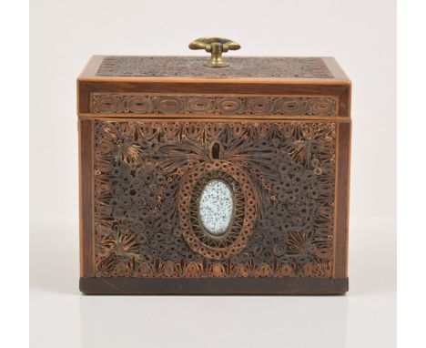 A George III rolled paper and mahogany shaped tea caddy, with boxwood stringing to the front aspect and with an oval mirror i