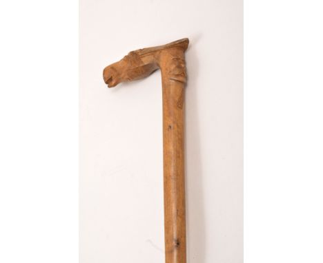 A Greek carved wood walking stick, Corfu, circa 1900, horse head design with a mask head, KEPKYPA, 91cm.