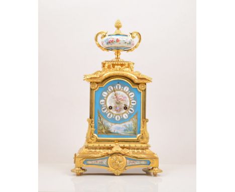 A French gilt metal and Sevres style porcelain mantel clock, by Japy Freres & Cie, in the Louis XVI style, urn finial, cast w