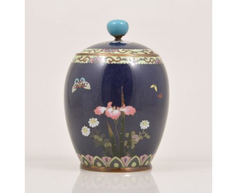 A Japanese cloisonne rich blue ground barrel shape jar, decorated with irises and other flowers by a stream and with birds, d
