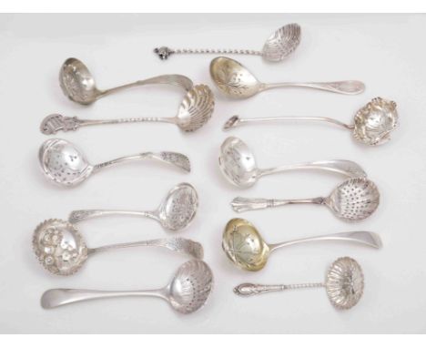 An Edwardian silver sifter spoon, by Henry Wilkinson Limited, Sheffield 1906, spiral twist handle with a cast swan terminal, 
