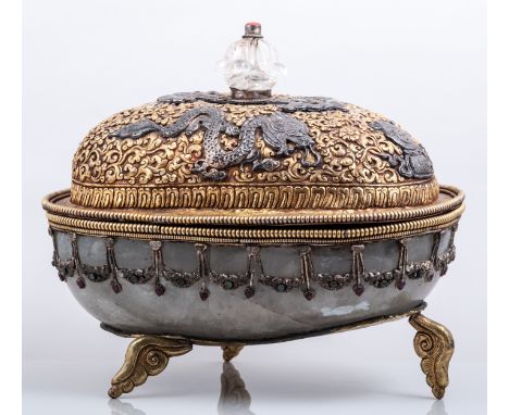 A Sino-Tibetan rock crystal and copper gilt ritual basin, perhaps 19th Century, swollen oval form, the domed lid with repouse