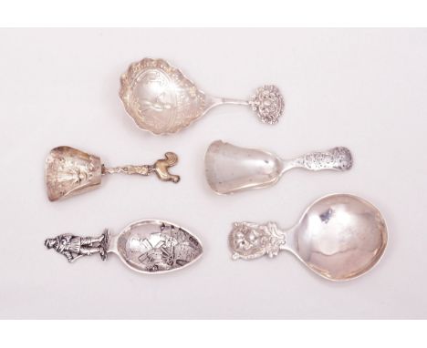 A Dutch silver spoon, bearing import marks, Chester 1909, armorial handle, cast bowl and four other Dutch silver caddy spoons