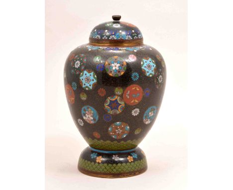 A Japanese cloisonne rich blue ground ovoid vase, two character mark, with a domed lid, decorated with scattered mons and ros