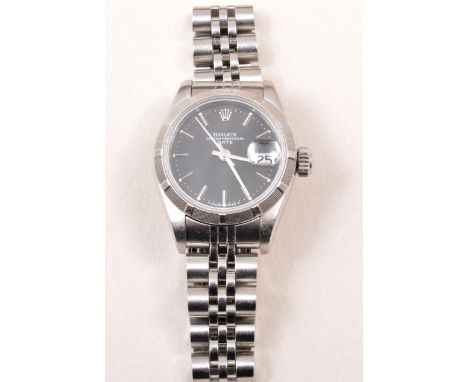 A lady's Rolex Oyster Perpetual wristwatch, black baton dial with date aperture and sweep seconds, stainless steel case with 