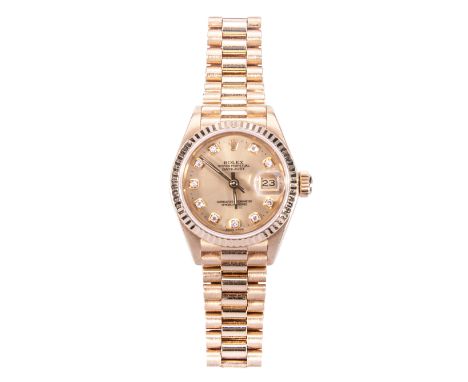 A lady's Rolex Oyster Perpetual Datejust wristwatch, champagne dial with diamond points, date aperture and sweep seconds, 18c