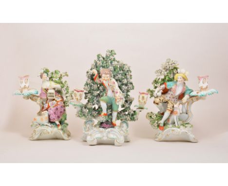 A pair of Derby bocage candlestick figures, Liberty and Matrimony, late 18th Century, modelled as a shepherd and shepherdess 