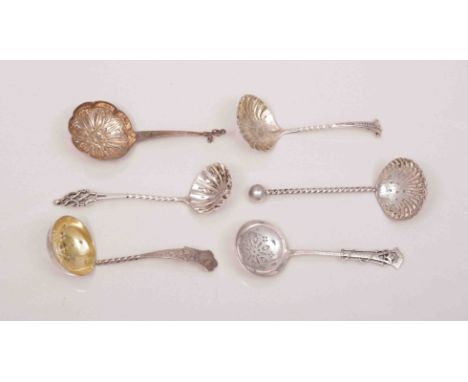 An Edwardian silver ladle shape sifter spoon, by Joseph Rogers & Sons, Sheffield 1908, beaded handle, scallop bowl and a coll