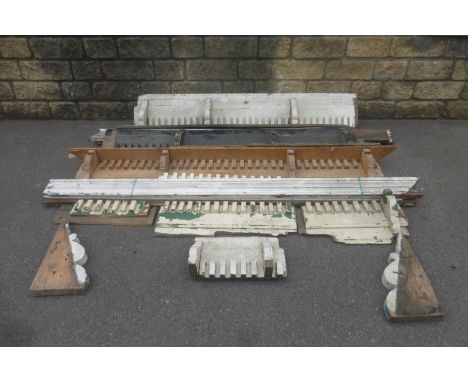 A selection of architectural salvage including architrave, pine shelves, chimney pots, a factory pulley and various signage.