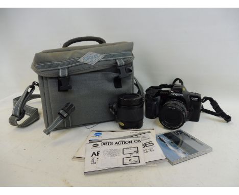 A Minolta Dynax 7000i camera with two lenses, bag and paperwork.