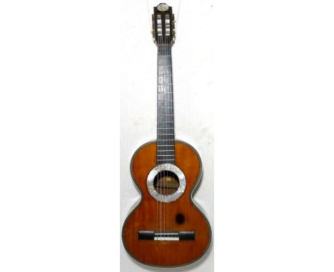 A mid 19th century French parlour guitate possibly by Lacote. Mother of pearl to the sound hole and original rosewood finger 