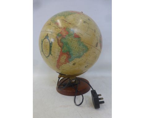 An illuminated globe lamp.