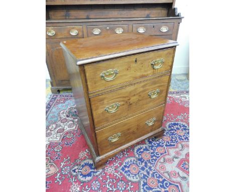 A mahogany chest of three drawers raised upon ogee bracket feet.