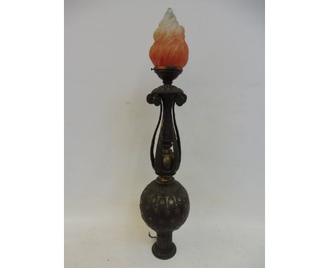 A very unusual Oriental lacquered brass lamp forming a post finial, surmounted by a glass 'flame' shade. 