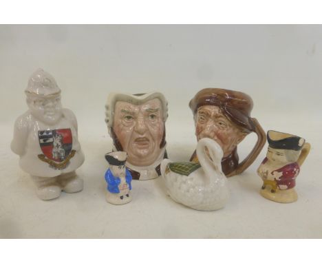 A small selection of ceramics including small Royal Doulton character jugs and a crested ware standing policeman for the City