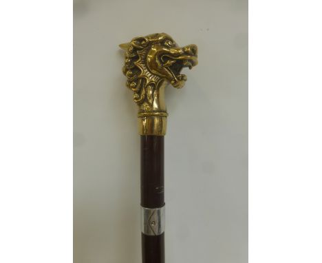 A walking stick, the knop being the head of a dragon.