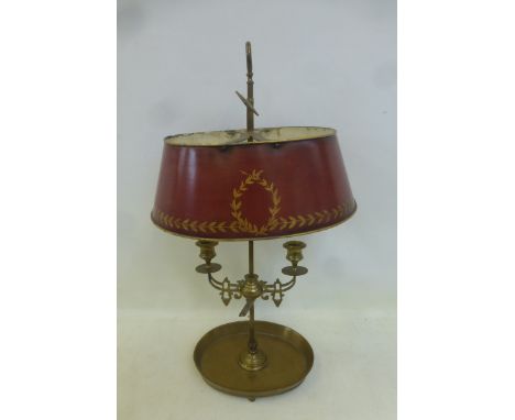 A brass table lamp with toleware shade. 
