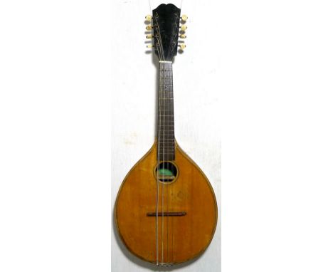A flat back mandolin with bone tuners, dating from around the mid 20th century. Thought to be German, the label identifies di