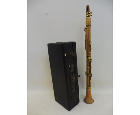 A mid 19th century eight key fruitwod clarinet with case.