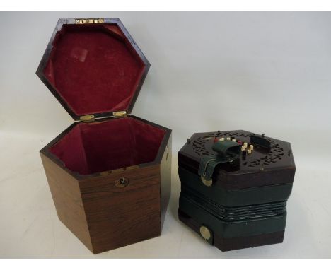 An English system 48 button concertina with rosewood ends labelled Thomas Dawkins with case.