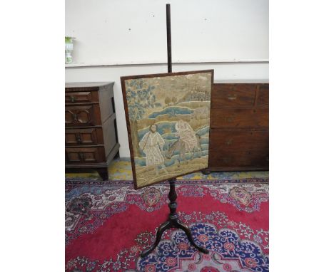 A 19th Century mahogany pole screen with an early tapestry panel, supported on a good quality tripod base. 