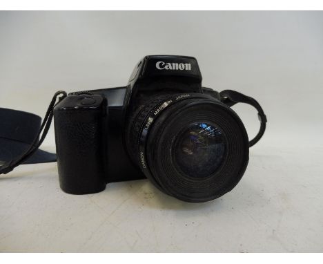 A Canon EOS 1000F camera with lens.