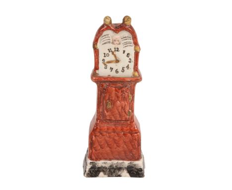 A Staffordshire pearlware model of a longcase clock, first quarter 19th century  A Staffordshire pearlware model of a longcas