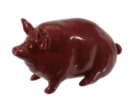 A Wemyss red piglet, circa 1900, impressed 'WEMYSS WARE R.H & S', 17cm long  A Wemyss red piglet, circa 1900,   impressed 'WE