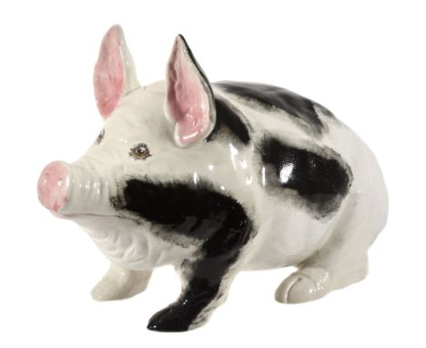 A Wemyss black and white pig, circa 1900, with pink ears and the eyes with...  A Wemyss black and white pig, circa 1900,   wi