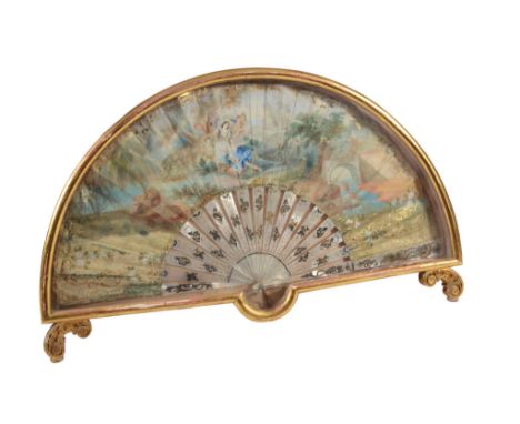 A painted and parcel gilt paper and decorated mother-of-pearl fan  A painted and parcel gilt paper and decorated mother-of-pe
