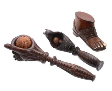 A mahogany and bone snuff box, circa 1870, carved as an open toed sandal  A mahogany and bone snuff box,   circa 1870, carved