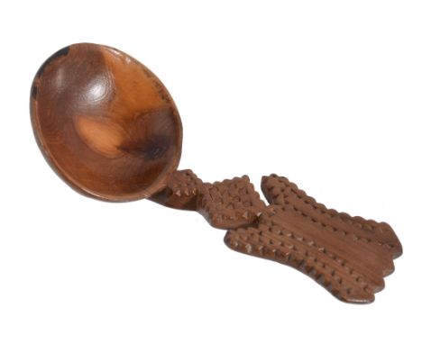 A fruitwood treen caddy spoon, circa 1800, with a chip carved shaped handle  A fruitwood treen caddy spoon,   circa 1800, wit