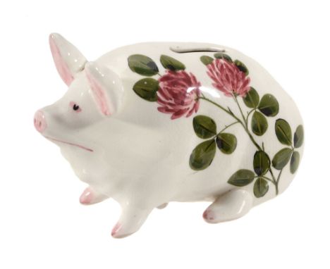 A Wemyss Bovey Tracey piglet money box, circa 1930 , painted with red clover  A Wemyss Bovey Tracey piglet money box, circa 1