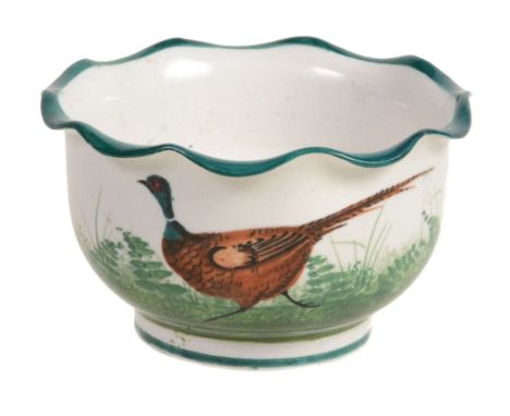 A small Wemyss bowl, circa 1900, painted with a running pheasant, wavy rim  A small Wemyss bowl, circa 1900,   painted with a